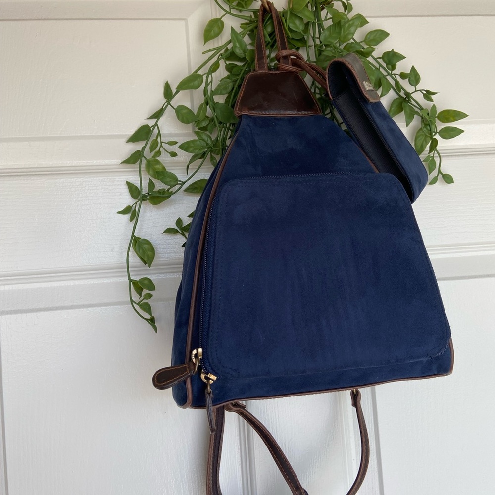 Blue suede, brown leather detail, villager backpack with matched phone carrier!
